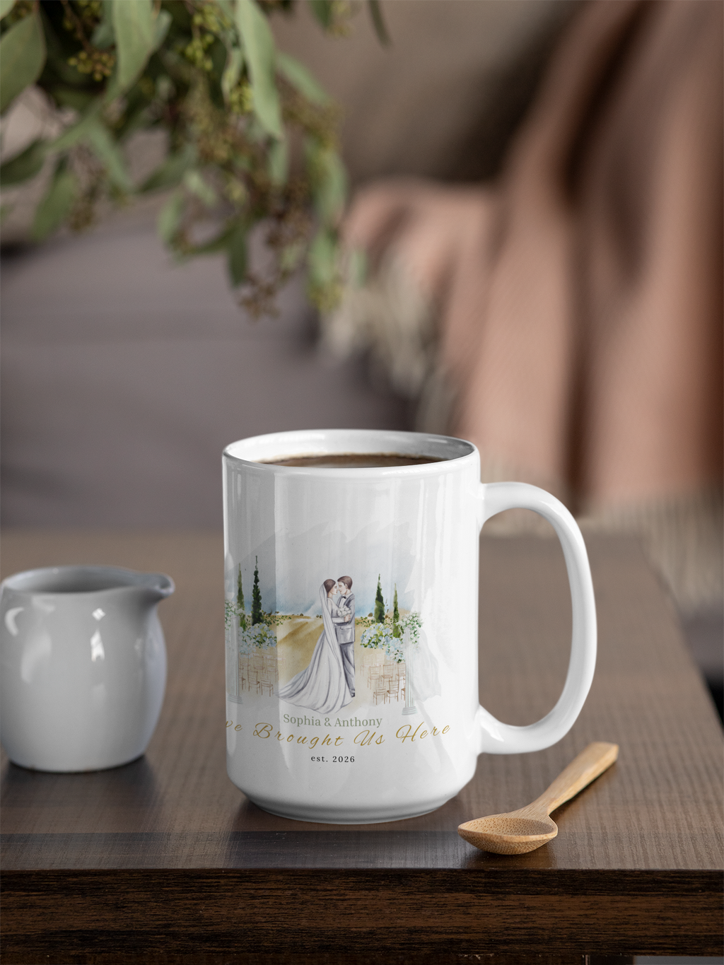 A roomy 15oz ceramic mug that holds morning coffee, late-night tea, and quiet moments together. The artful watercolor scene shows a newlywed couple embraced against a soft pastoral backdrop — gentle greens, warm fields, and a hint of sky —