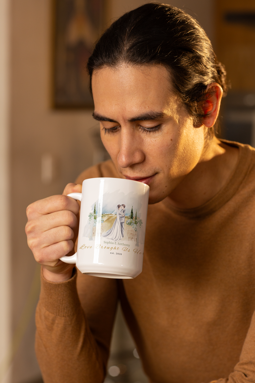 A roomy 15oz ceramic mug that holds morning coffee, late-night tea, and quiet moments together. The artful watercolor scene shows a newlywed couple embraced against a soft pastoral backdrop — gentle greens, warm fields, and a hint of sky —