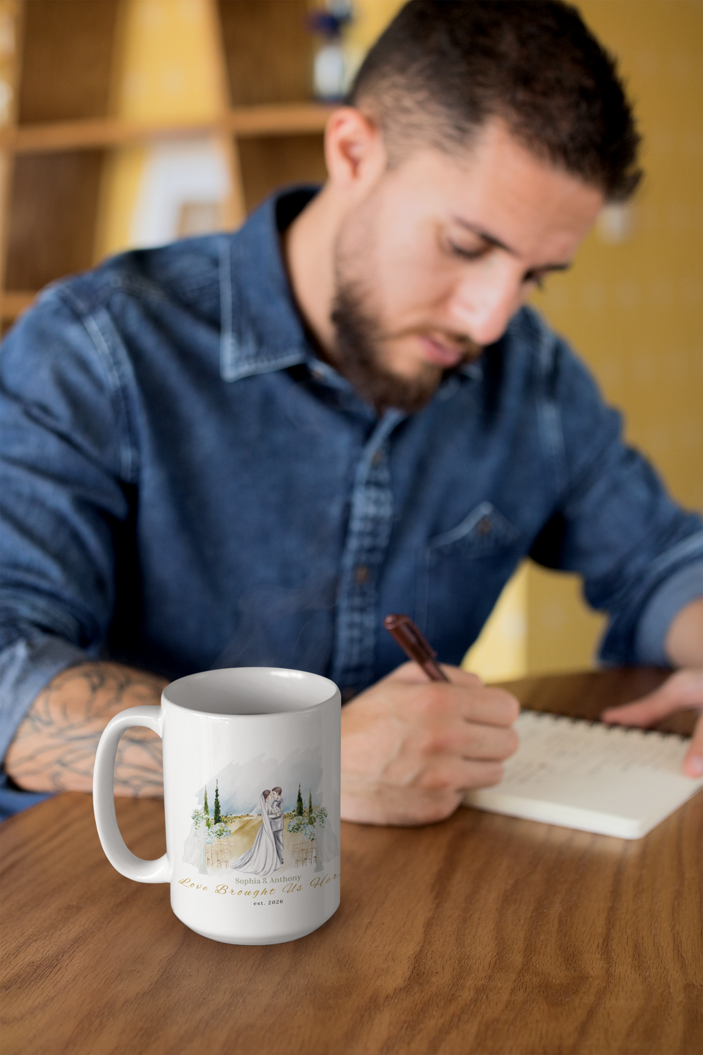 A roomy 15oz ceramic mug that holds morning coffee, late-night tea, and quiet moments together. The artful watercolor scene shows a newlywed couple embraced against a soft pastoral backdrop — gentle greens, warm fields, and a hint of sky —